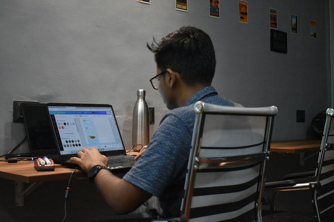 young programmer learning on laptop