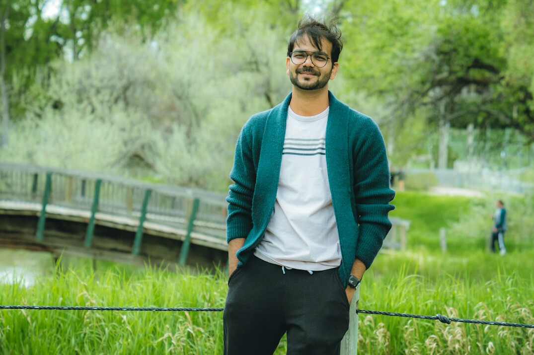 Portrait of an Indian-Malaysian man smiling, backend development instructor