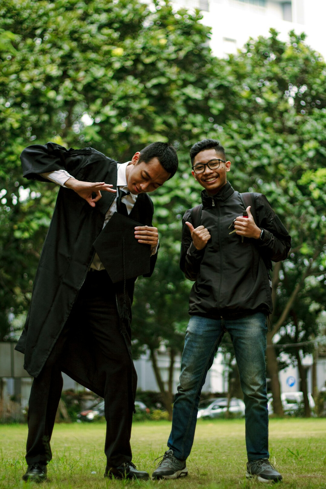 Two Malaysian software developers celebrating after launching a project