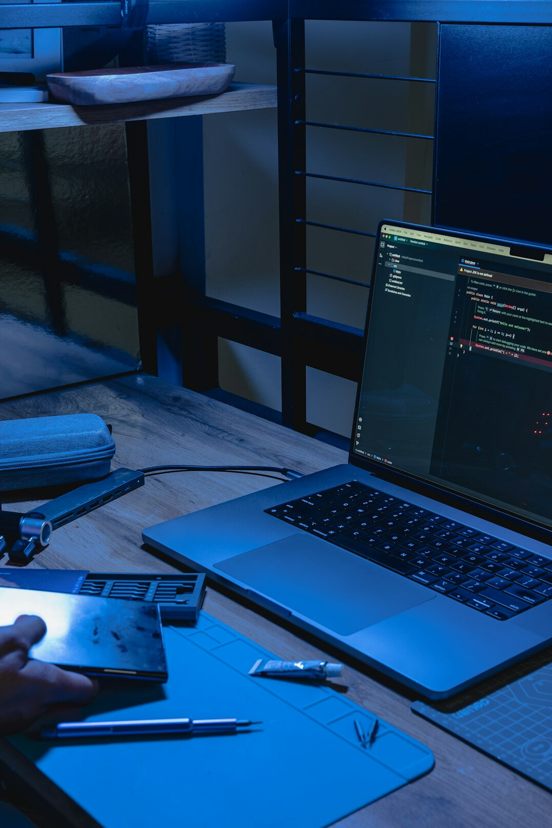 programmer at desk with laptop