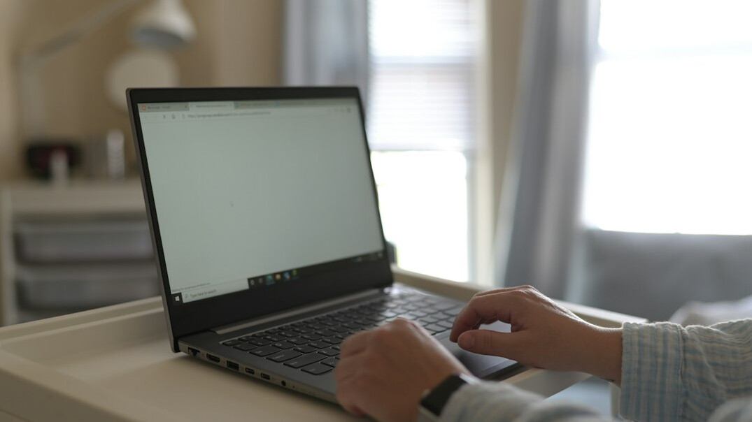 coding on laptop at home